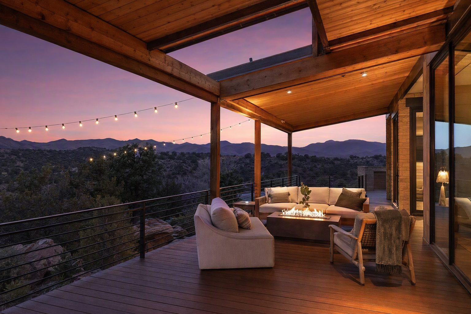 Covered cedar deck with fire table glowing at dusk